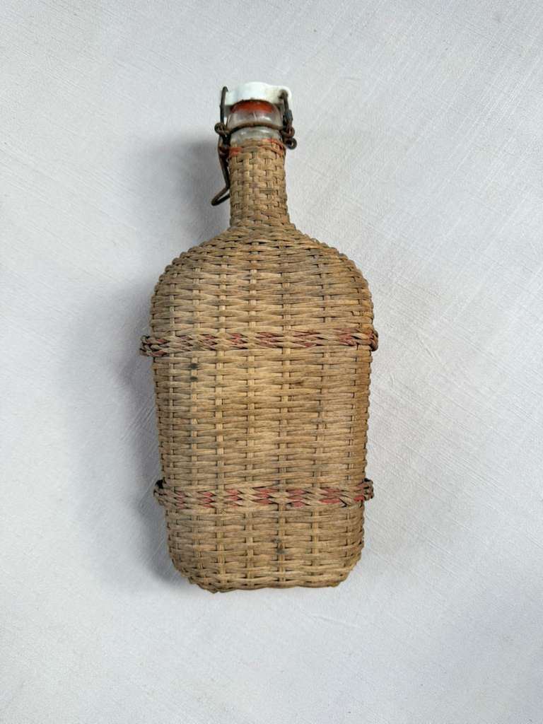 Vintage Lourdes Rattan Wrapped Bottle with Ceramic Swing Top Stopper - Collector & Curator