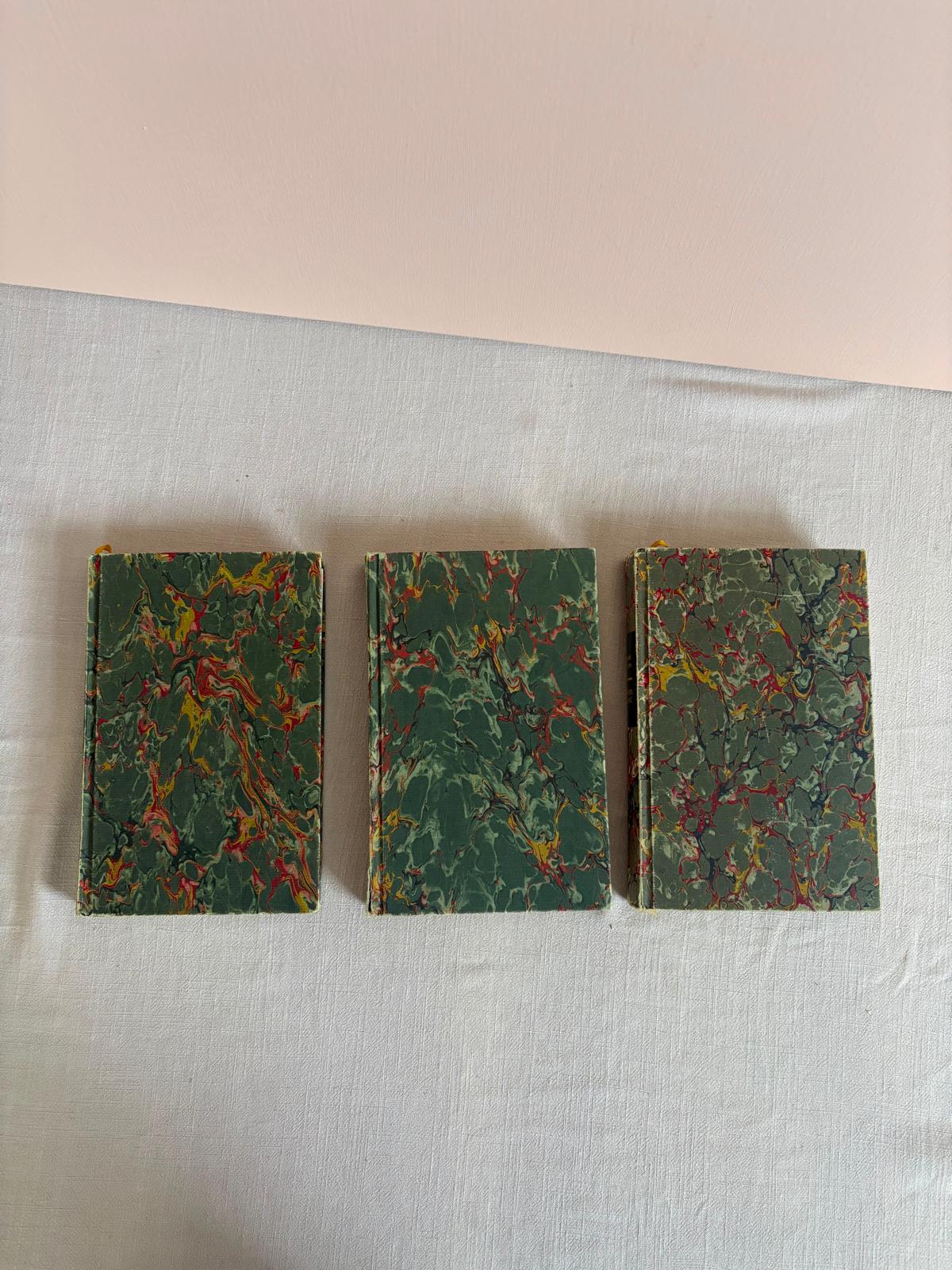 Three vintage marbled books