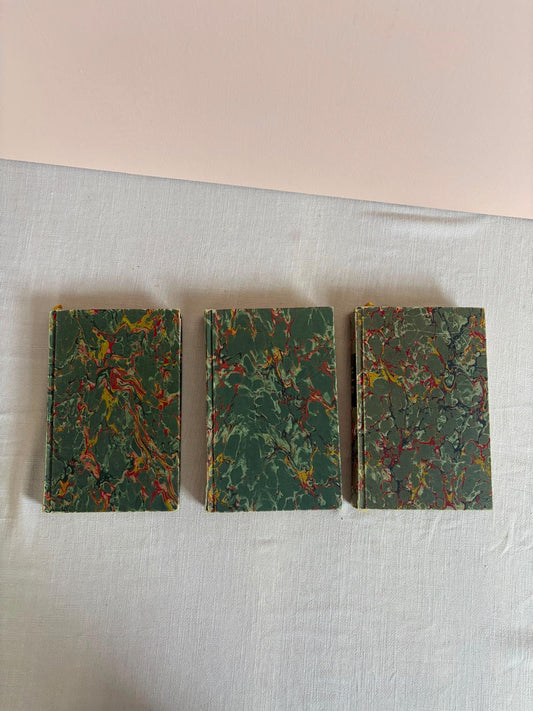 Three vintage marbled books