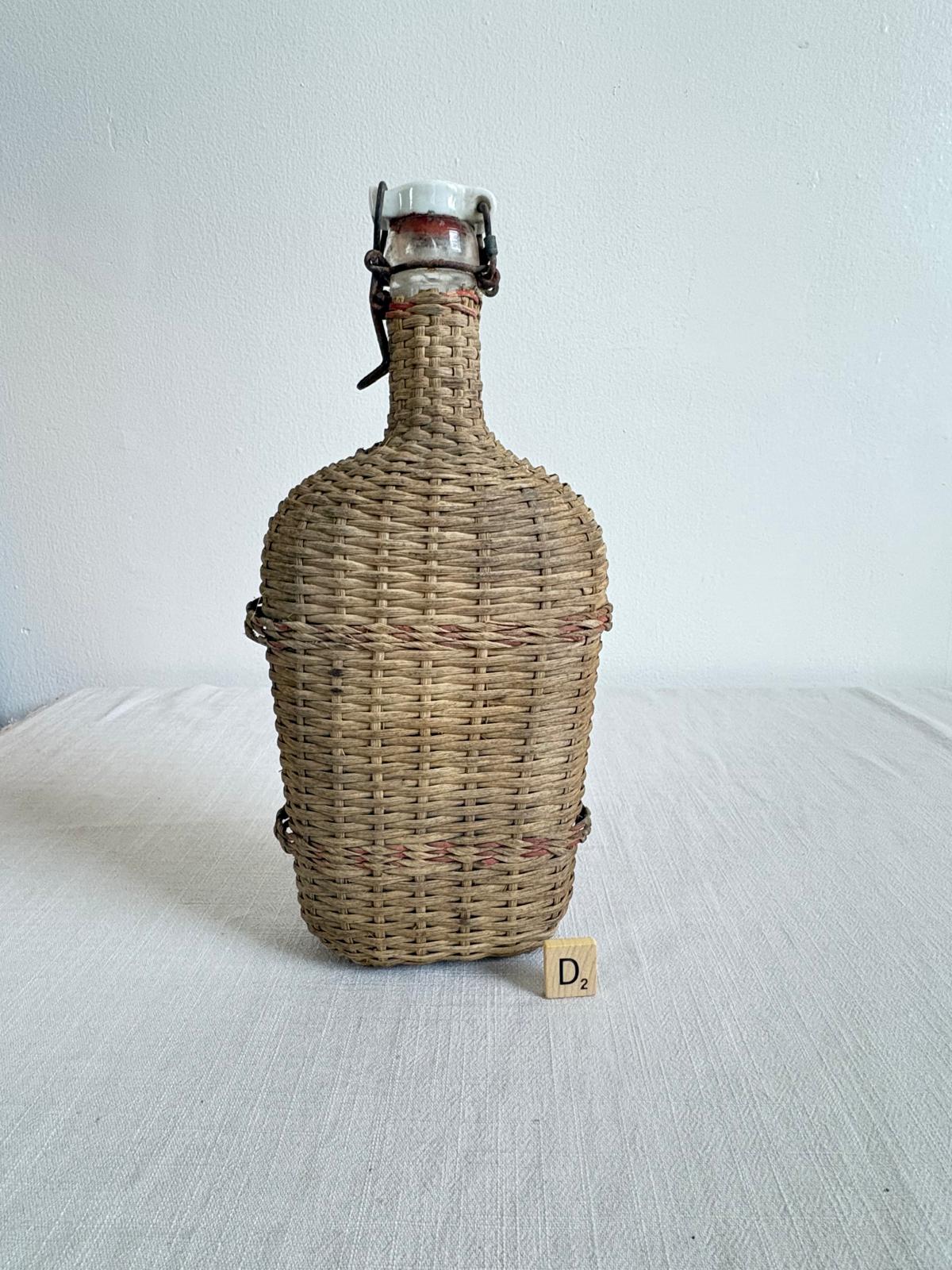 Vintage Lourdes Rattan Wrapped Bottle with Ceramic Swing Top Stopper - Collector & Curator