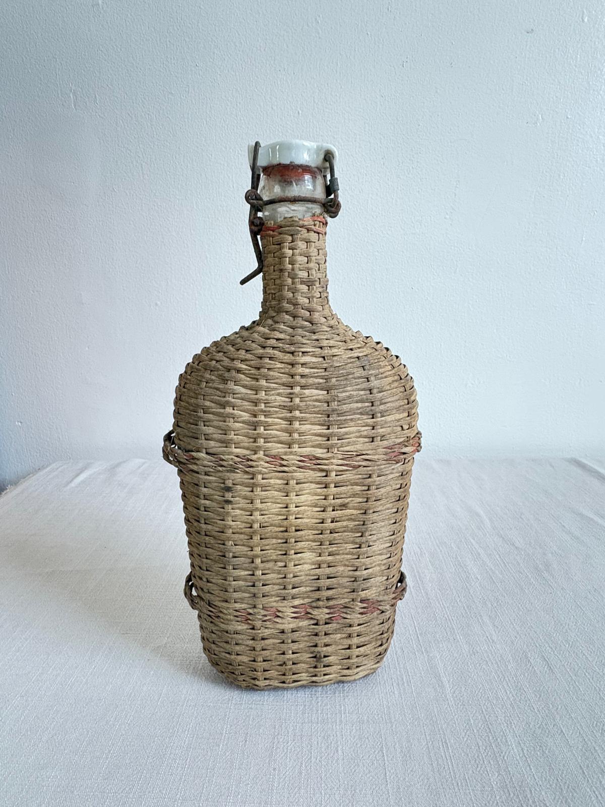 Vintage Lourdes Rattan Wrapped Bottle with Ceramic Swing Top Stopper - Collector & Curator