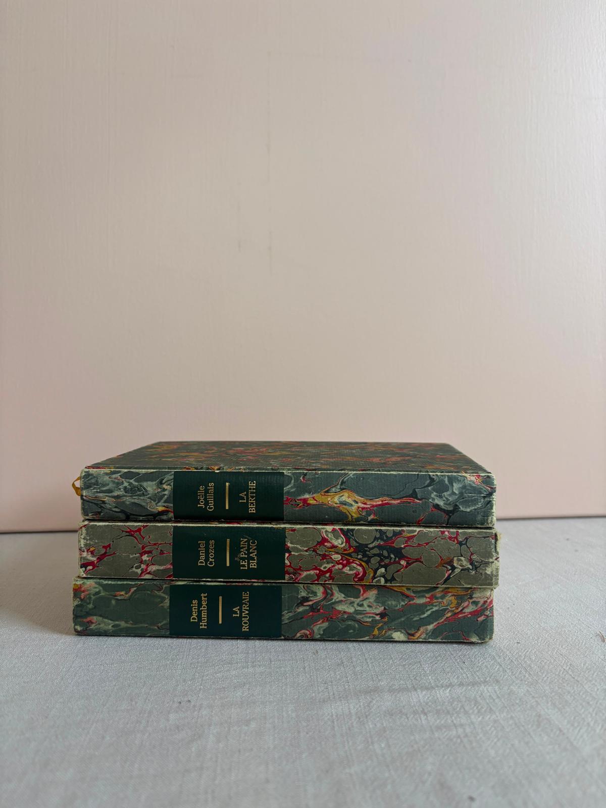 Three vintage marbled books
