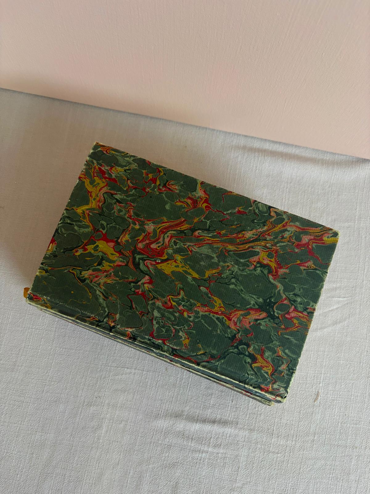 Three vintage marbled books